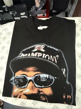 Graphic Black Tee with Champion Cap Print